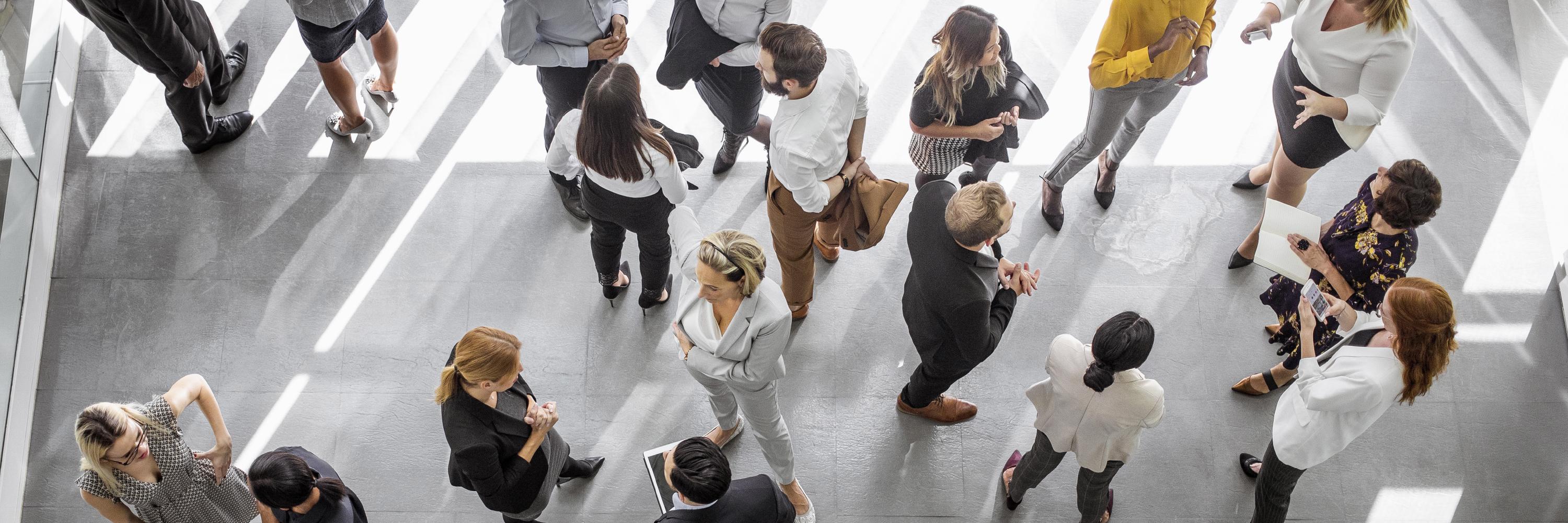 Photo from above of people speaking in small groups